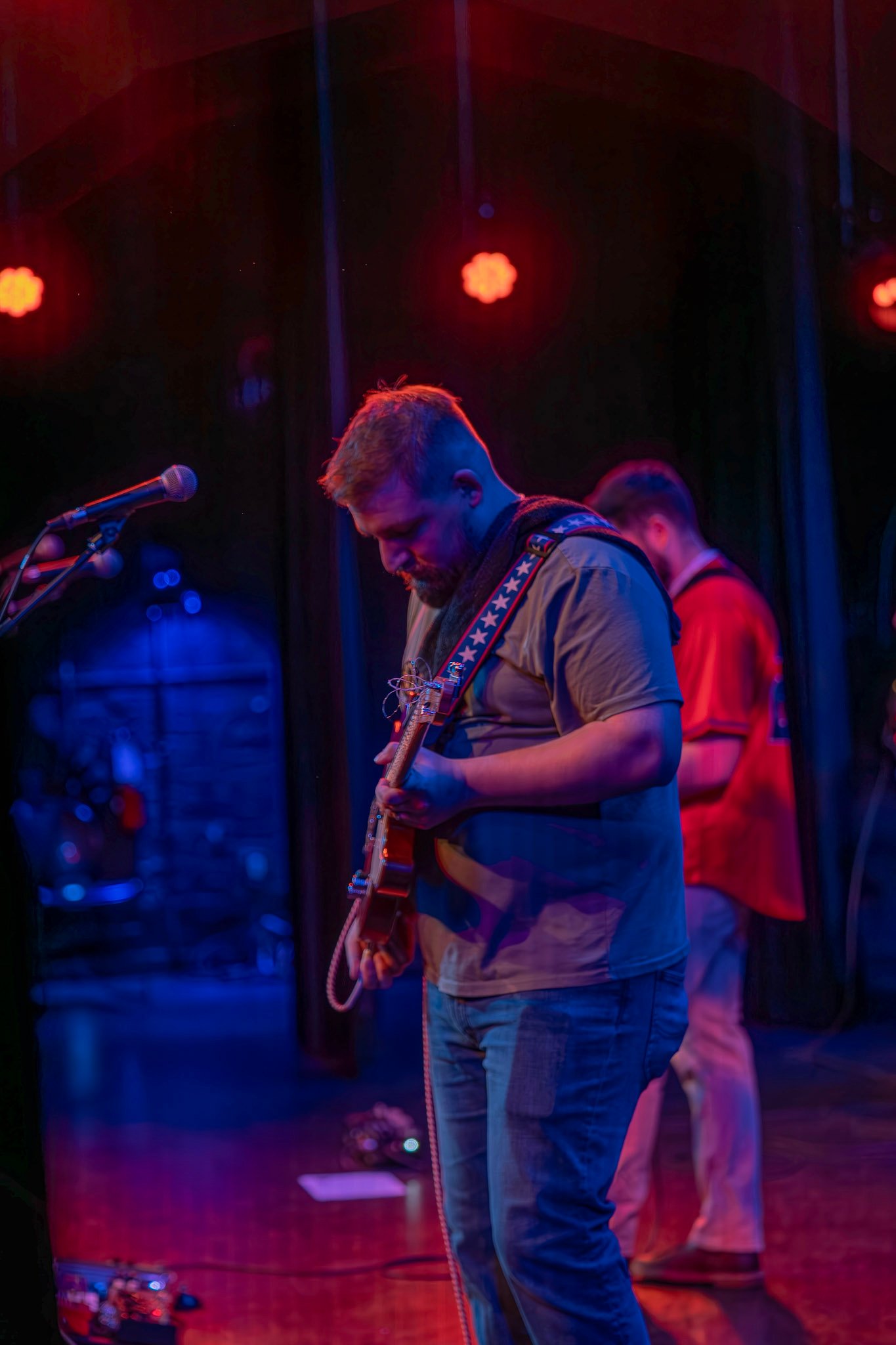 Catch Ya’ll in the Holler Micah Playing guitar with Aboveground.